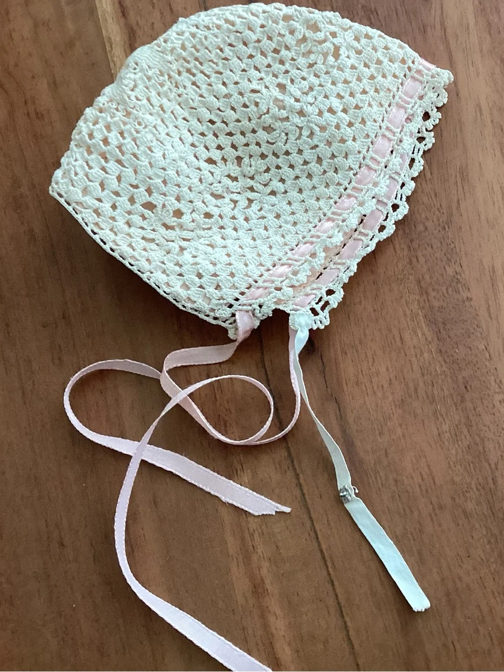 Vintage 1940s infant baby bonnet with delicate hand—crocheted cream color